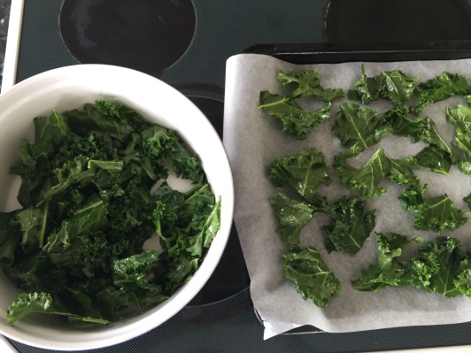 place kale pieces flat on baking tray