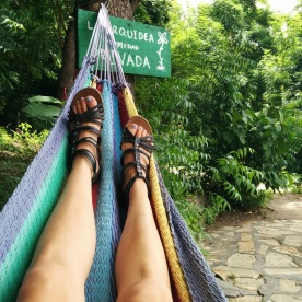 Relaxing in a handcrafted hammock beside Laguna de Apoyo